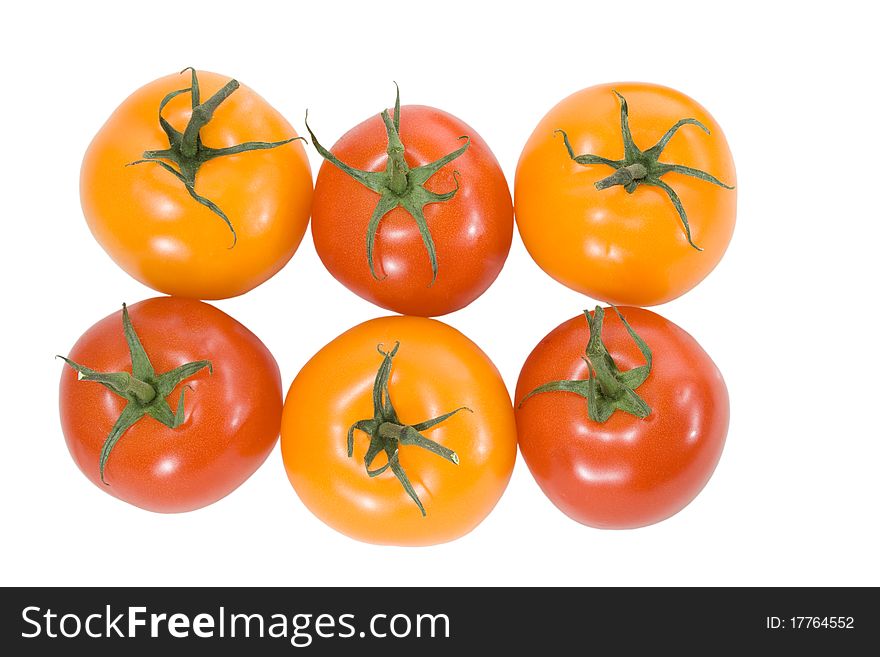 Red and yellow tomatoes on the white background