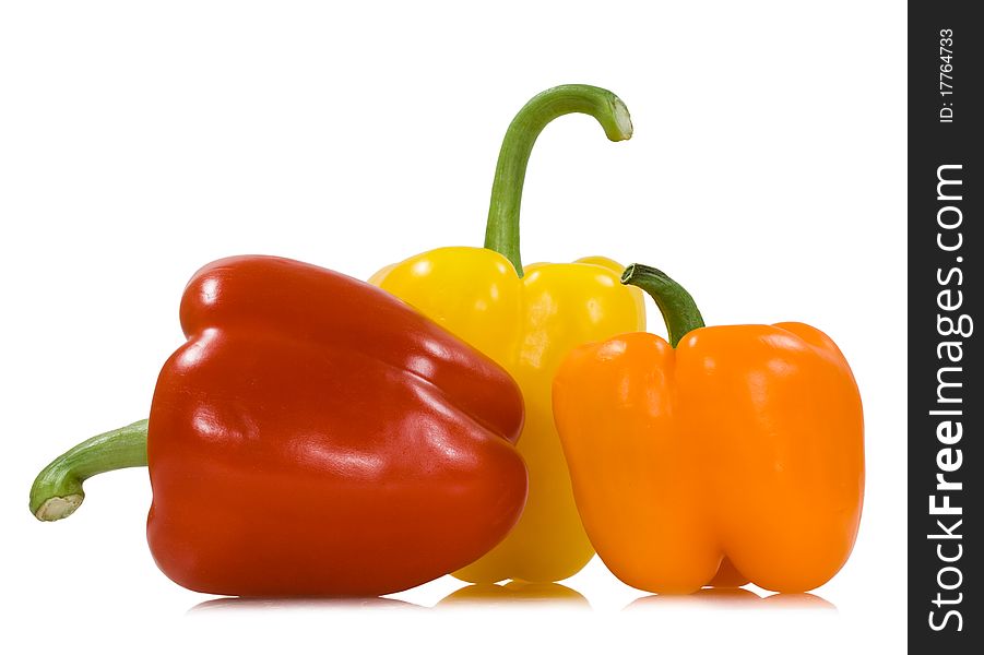 Red orange yellow peppers isolated on the white background