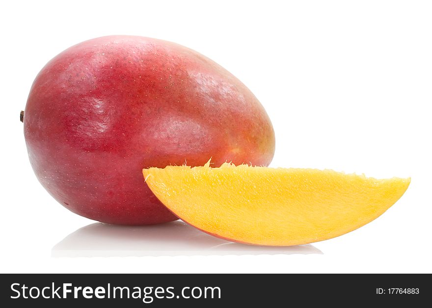 Fresh mango with a yellow slice isolated on the white background