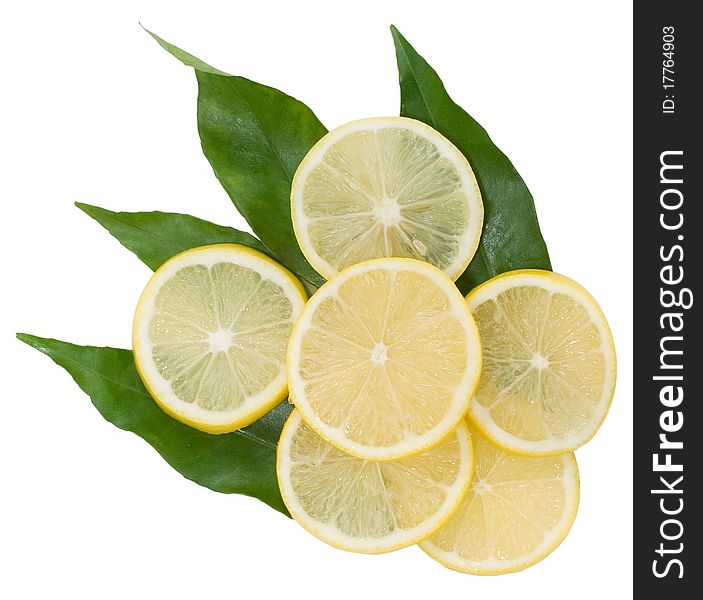 Yellow lemons on the green leaves isolated on the white background