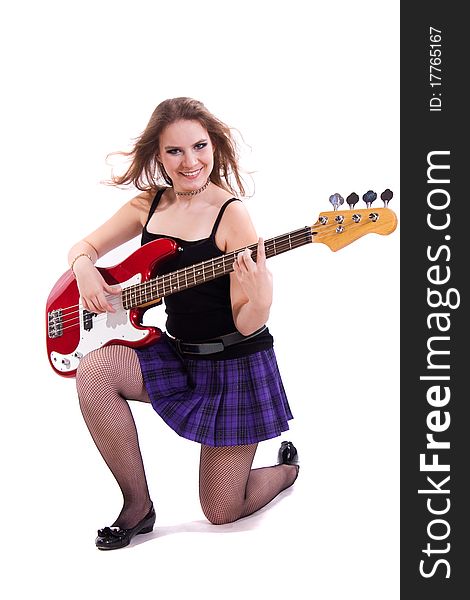 Rock star. Teenager girl playing a bass guitar isolated on white. Rock star. Teenager girl playing a bass guitar isolated on white.