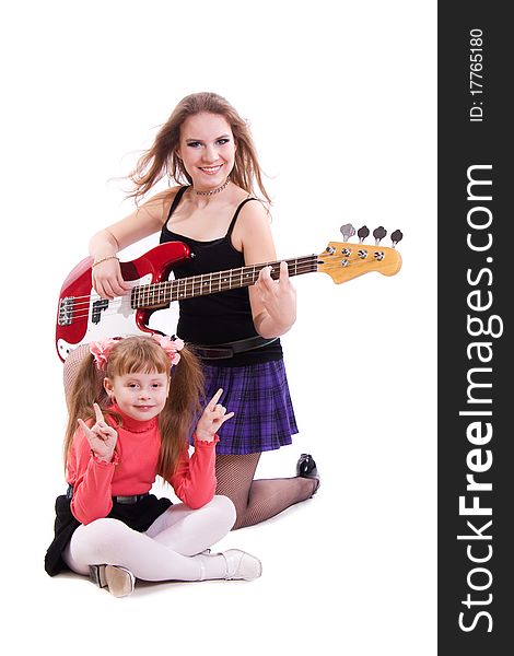 Teenage Rockstar. Teenager girl playing a bass guitar isolated on white. Teenage Rockstar. Teenager girl playing a bass guitar isolated on white.