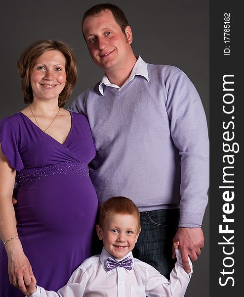 Beautiful couple with son in expectant of the second child. Beautiful couple with son in expectant of the second child