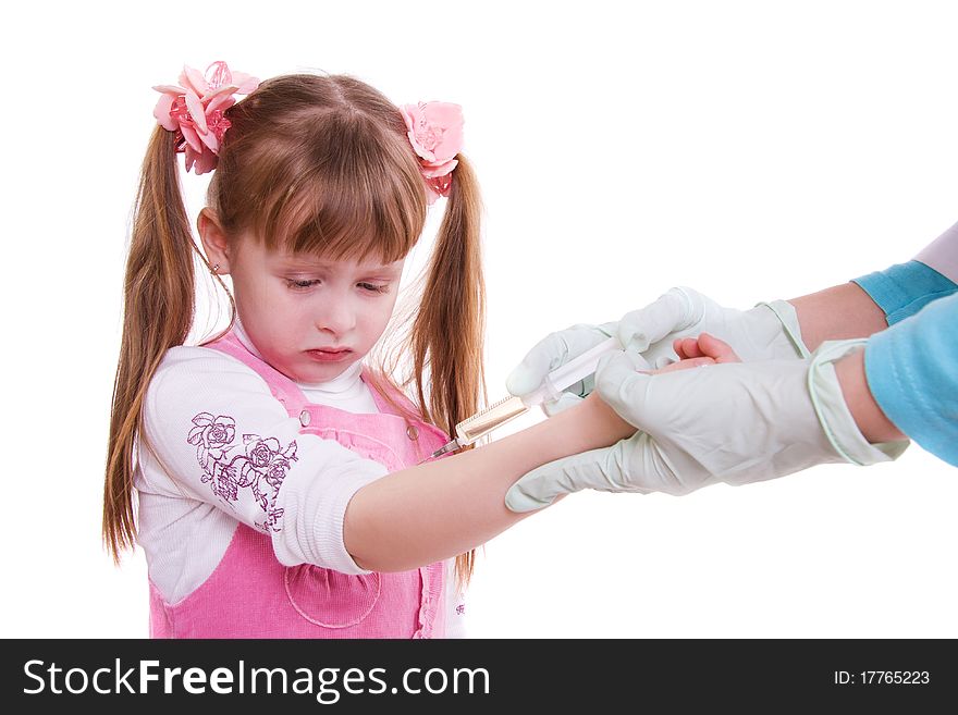 Little girl becomes vaccination by a doctor (symbolic). Little girl getting an injection. Little girl becomes vaccination by a doctor (symbolic). Little girl getting an injection..