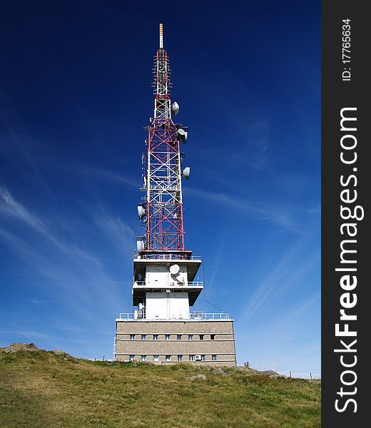 A communications tower for tv and mobile phone signals. A communications tower for tv and mobile phone signals.