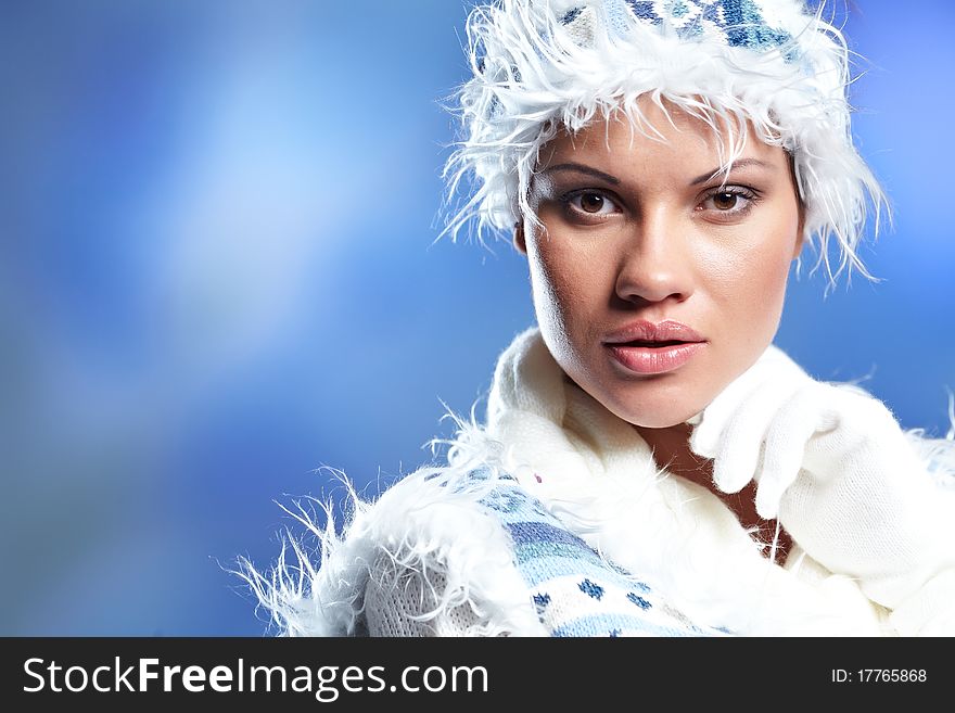 Portrait of beautiful young woman wearing fashion winter clothing