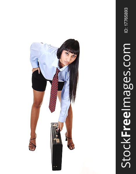 A pretty business woman in shorts, blue shirt and tie bending down to 
her briefcase, smiling into the camera, on white background. A pretty business woman in shorts, blue shirt and tie bending down to 
her briefcase, smiling into the camera, on white background.