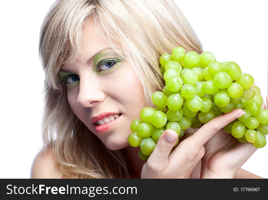 Beautiful woman over white background with grape. Beautiful woman over white background with grape