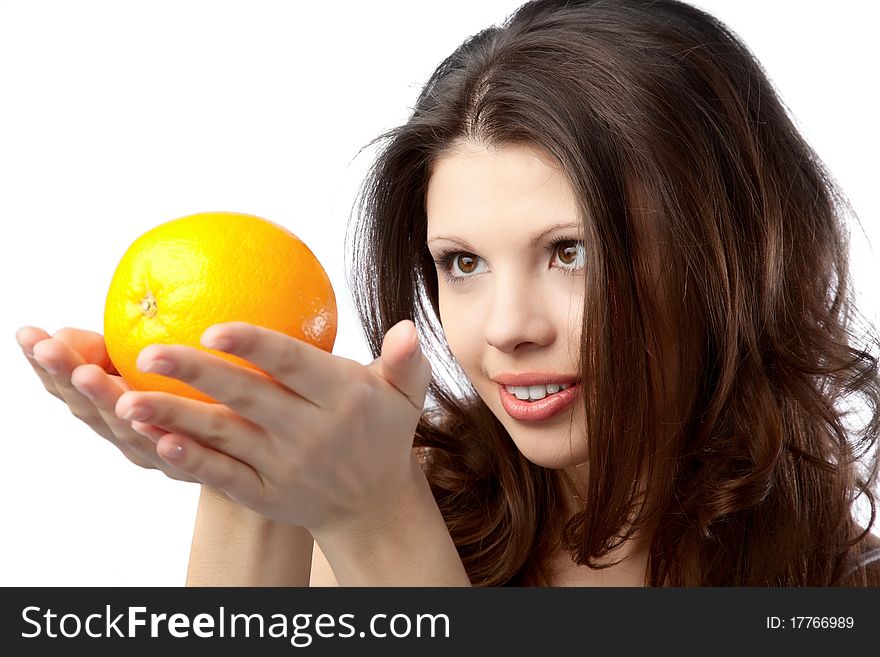 Beautiful young woman holding an orange. Close up. Beautiful young woman holding an orange. Close up