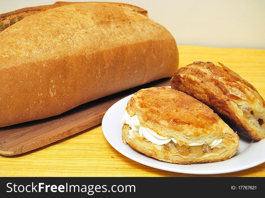 Puff pastry with apples and cream and white bread. Puff pastry with apples and cream and white bread