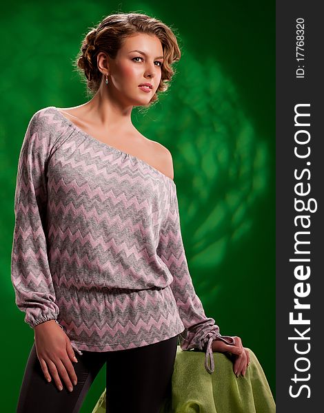Young attractive woman in fashionable clothing on isolated background. Young attractive woman in fashionable clothing on isolated background