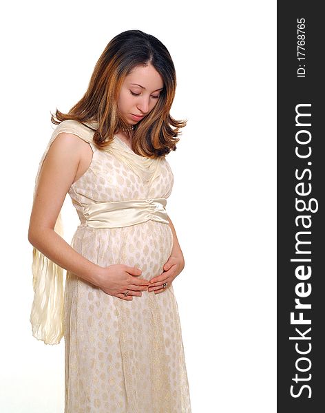 Young pregnant hispanic woman in a fancy evening dress. Young pregnant hispanic woman in a fancy evening dress