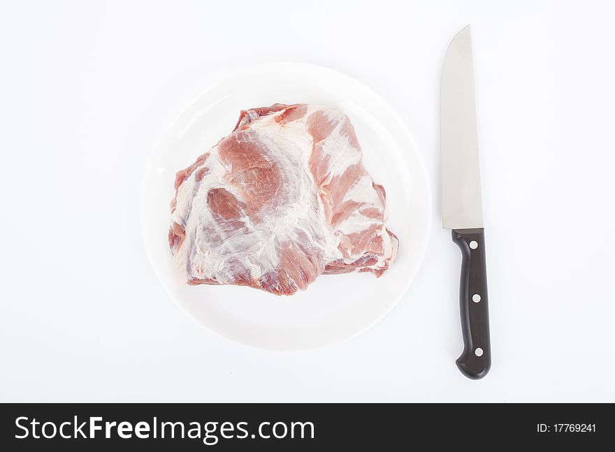 Crude meat closeup on a white backgrounds