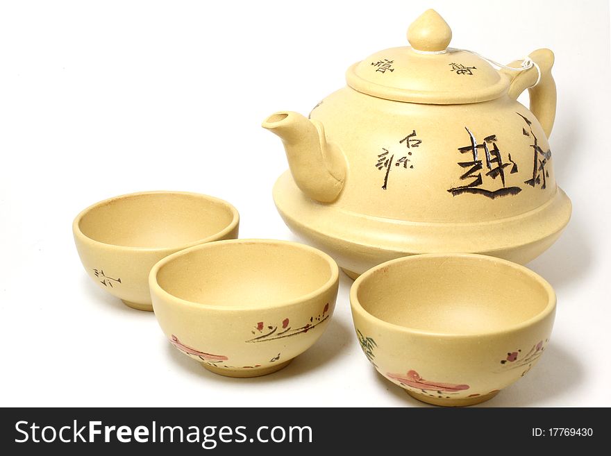 Chinese teapot with cups for tea leaves of green tea