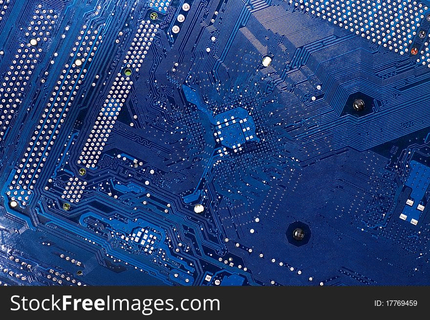 Close up of computer circuit board in blue