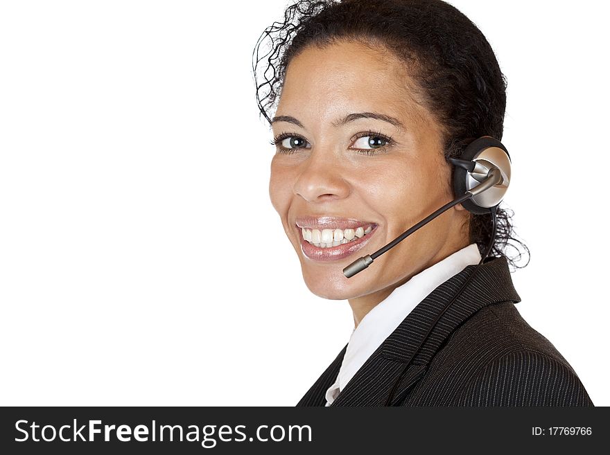 Smiling attractive woman makes with headset a call. Isolated on white background.