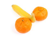 Banana And Two Tangerines. Stock Photos