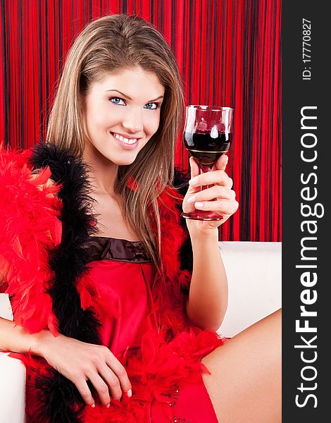 Beauty girl with a glass of red wine