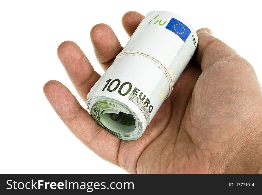 Roll of hundred euro in hand on the white background. Roll of hundred euro in hand on the white background