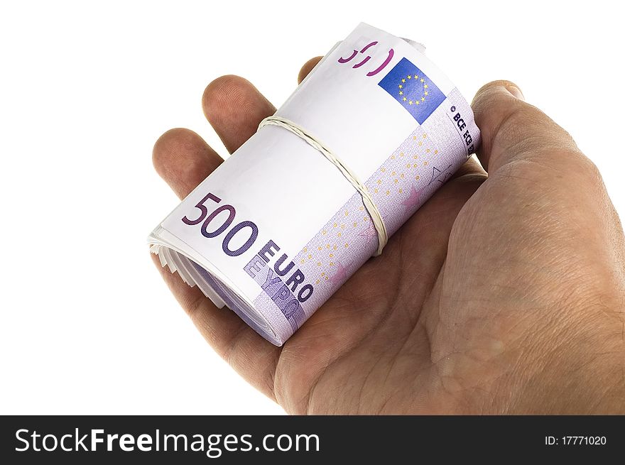 Roll of 500 euro in hand on the white background. Roll of 500 euro in hand on the white background