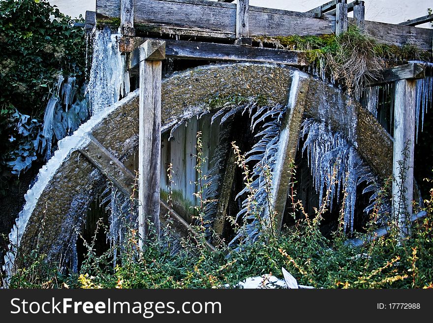 Frozen water wheel with icicles