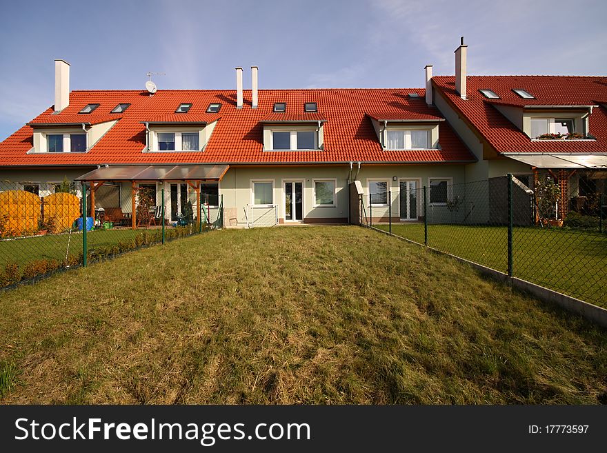 Row house in the middle with garden lawn. Row house in the middle with garden lawn