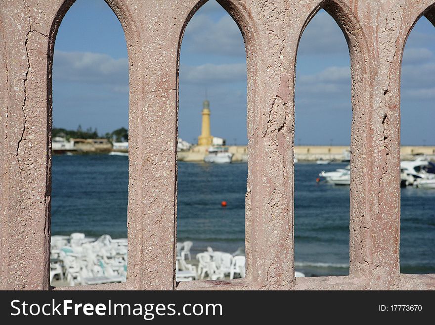 Egypt. Alexandria. View from the Bridge over the Mediterranean Sea, a lighthouse, beach and yacht. Egypt. Alexandria. View from the Bridge over the Mediterranean Sea, a lighthouse, beach and yacht.