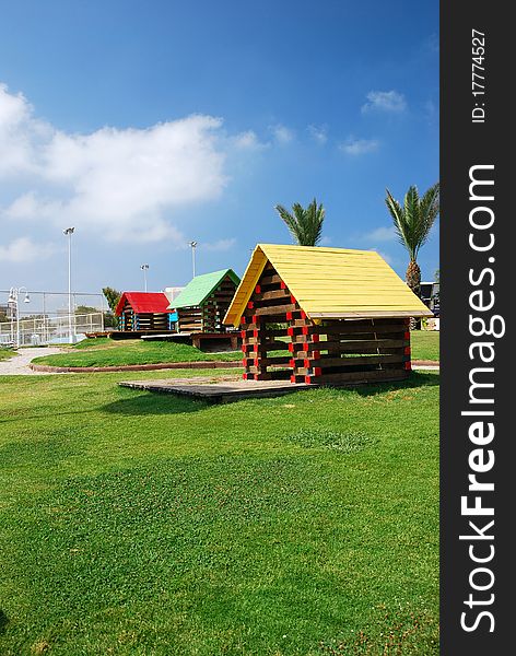 Children's house on the ground with green grass