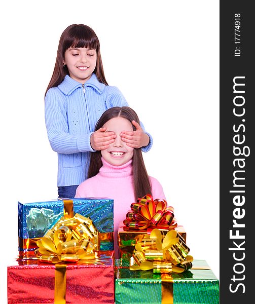 Two little girls with a gift boxes. isolated on white. Two little girls with a gift boxes. isolated on white