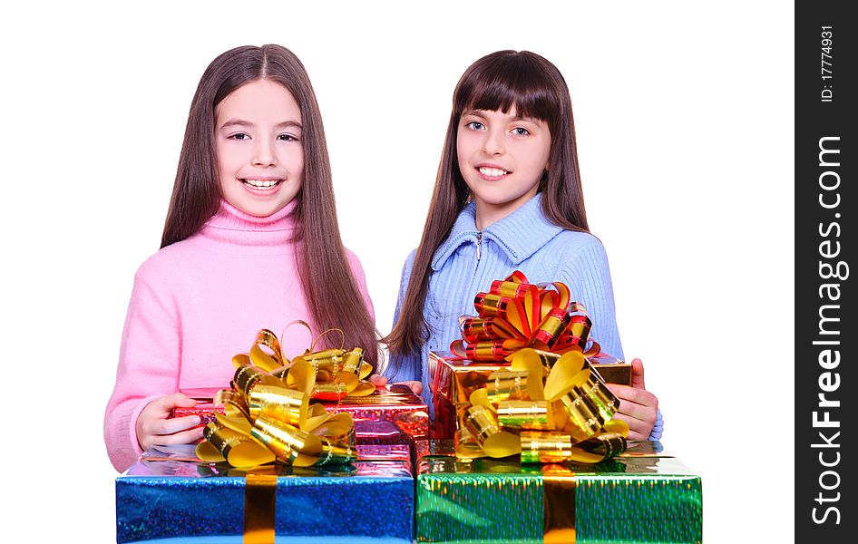 Two little girls with a gift boxes. isolated on white. Two little girls with a gift boxes. isolated on white
