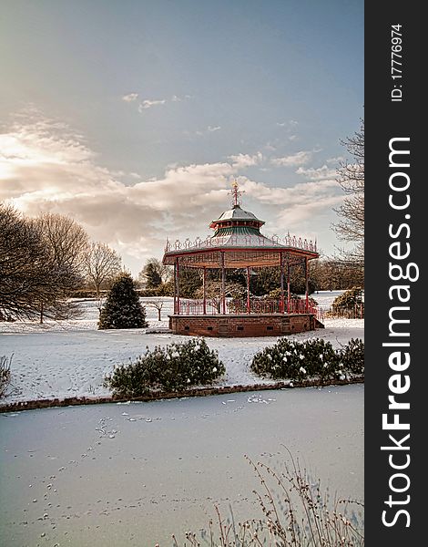 The bandstand and frozen lake in winter at sefton park liverpool