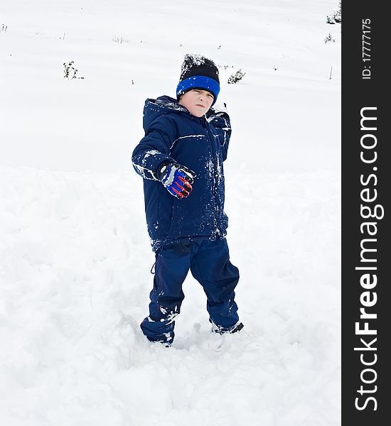 Little boy throwing a snowball. Little boy throwing a snowball
