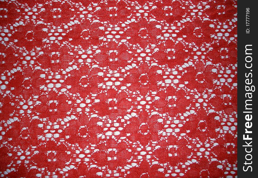 Beautiful red textile/lace on white background.