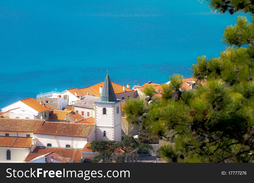 View on the village with church on the adriatic coast. View on the village with church on the adriatic coast