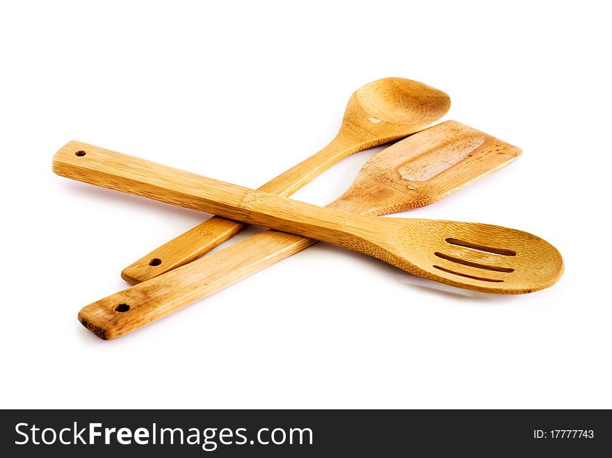 Set of kitchen utensils made of bamboo, white background. Set of kitchen utensils made of bamboo, white background