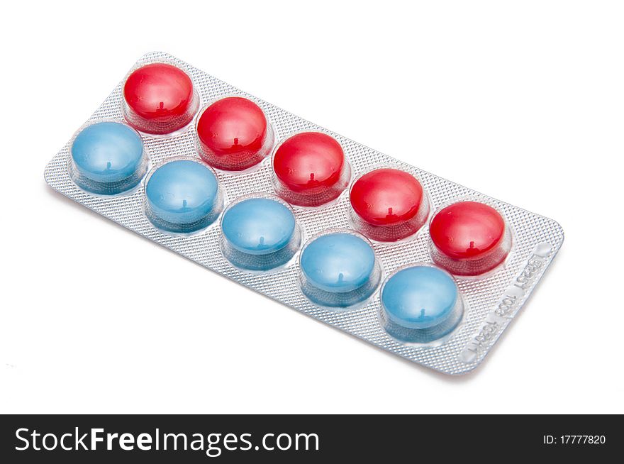 Multi-colored tablets on the white background