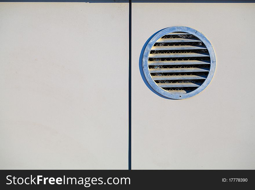 Architectural details: ventilation lattice on wall of building