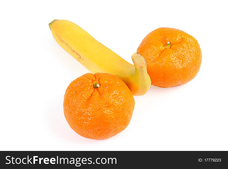 Banana and two tangerines. Isolated over white