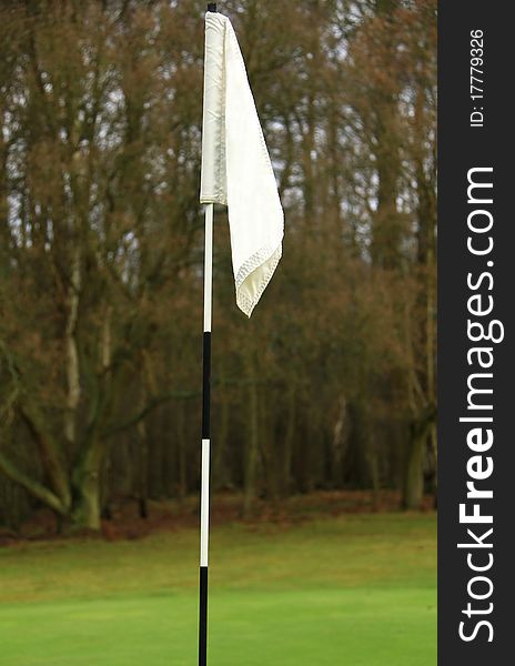 Golfing flag with black and white pole. Golfing flag with black and white pole