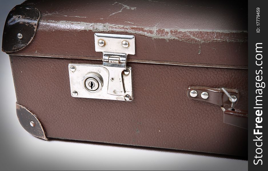 Vintage suitcase with a lock in close up