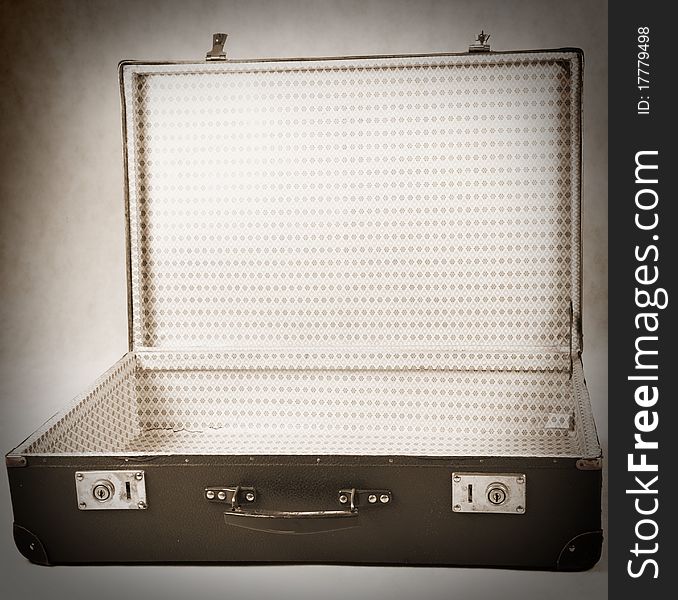 Vintage suitcase - opened - on white background in sepia