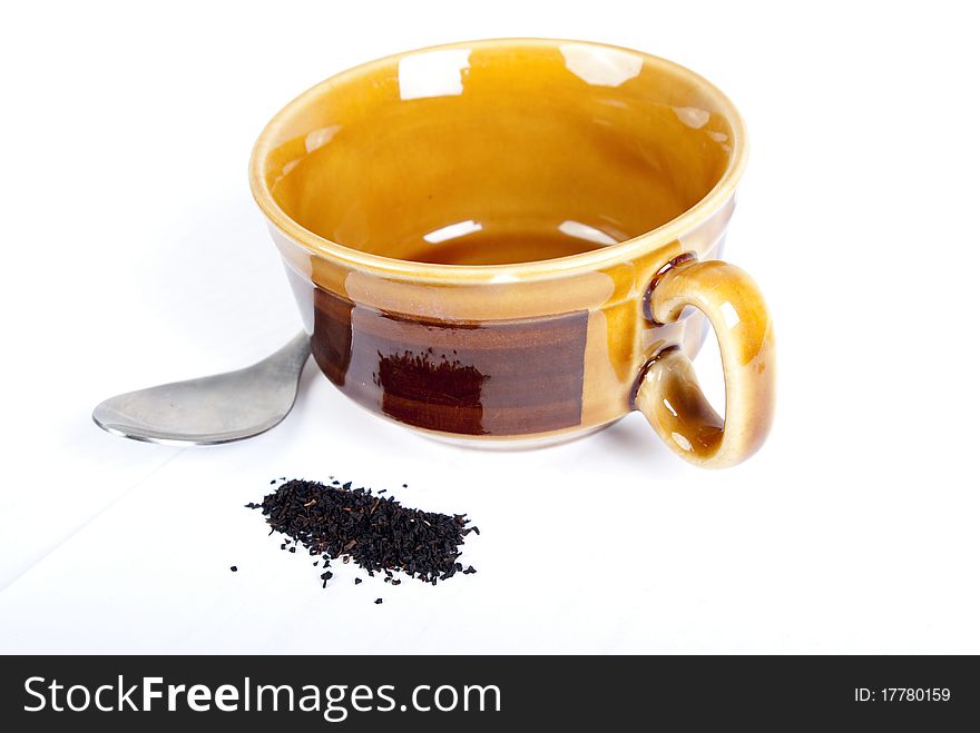 Empty cup of tea with spoon