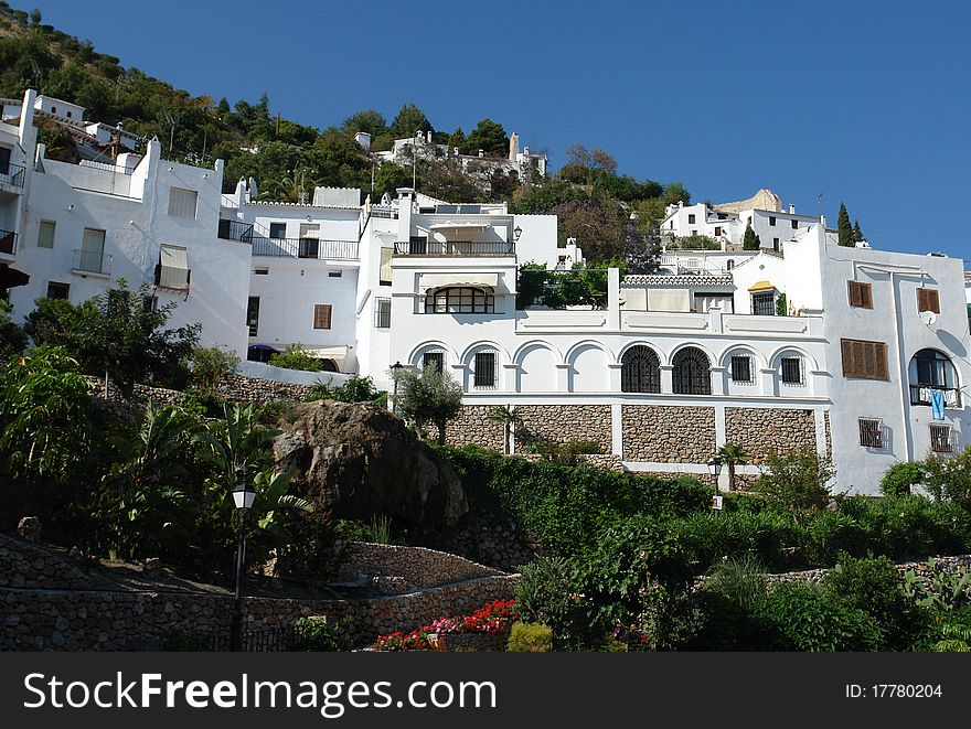 An Andalusian village about one hour northeast of Malaga built on a hillside.