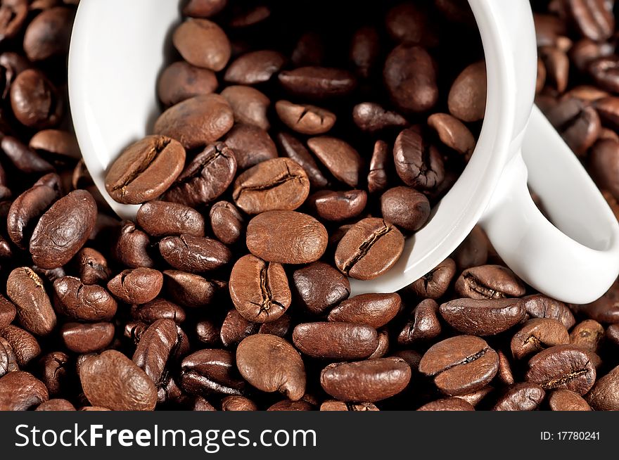 Cup on heap of coffee beans. Cup on heap of coffee beans