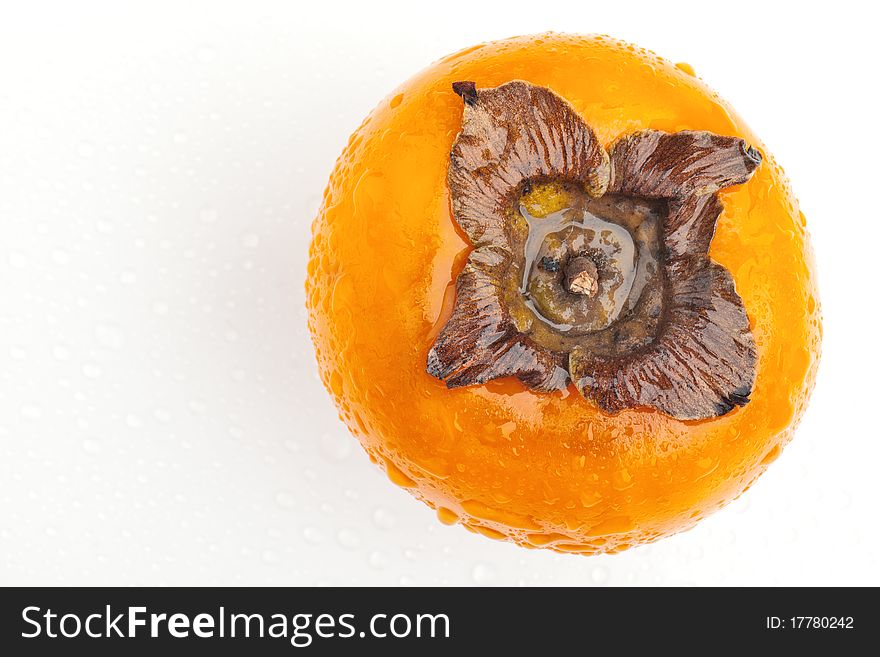 Persimmon fruit with drops of water
