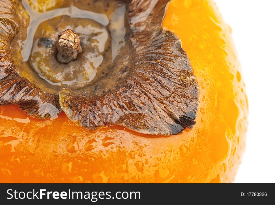 Persimmon fruit with drops of water