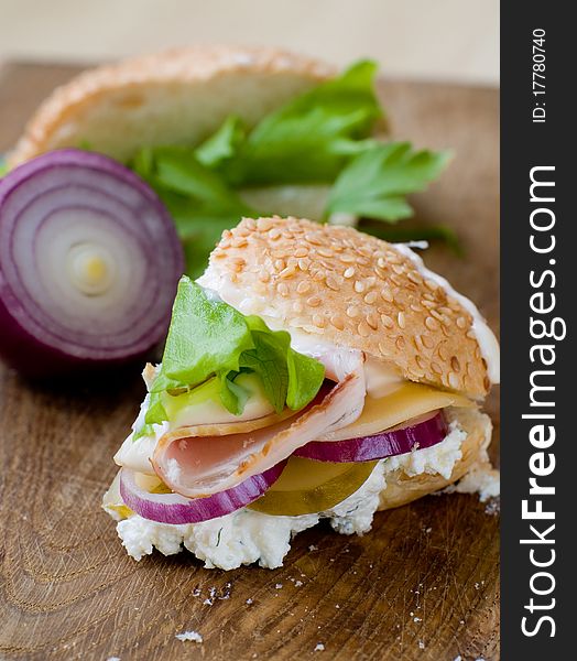 Rustic Sandwich with Lettuce, Cucumber, Ham and Red Onions