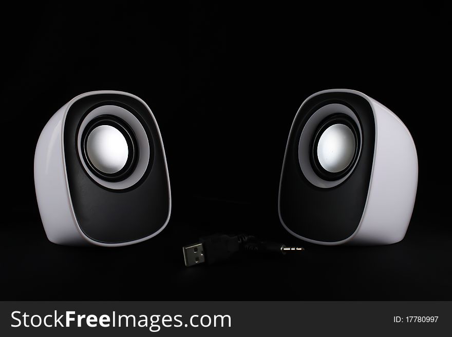 Speaker white on a black background. Speaker white on a black background.