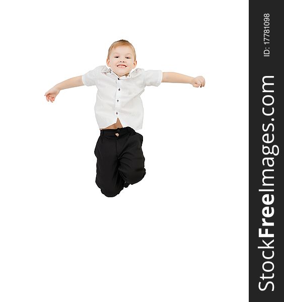 Adorable child jumping proudly a over white background