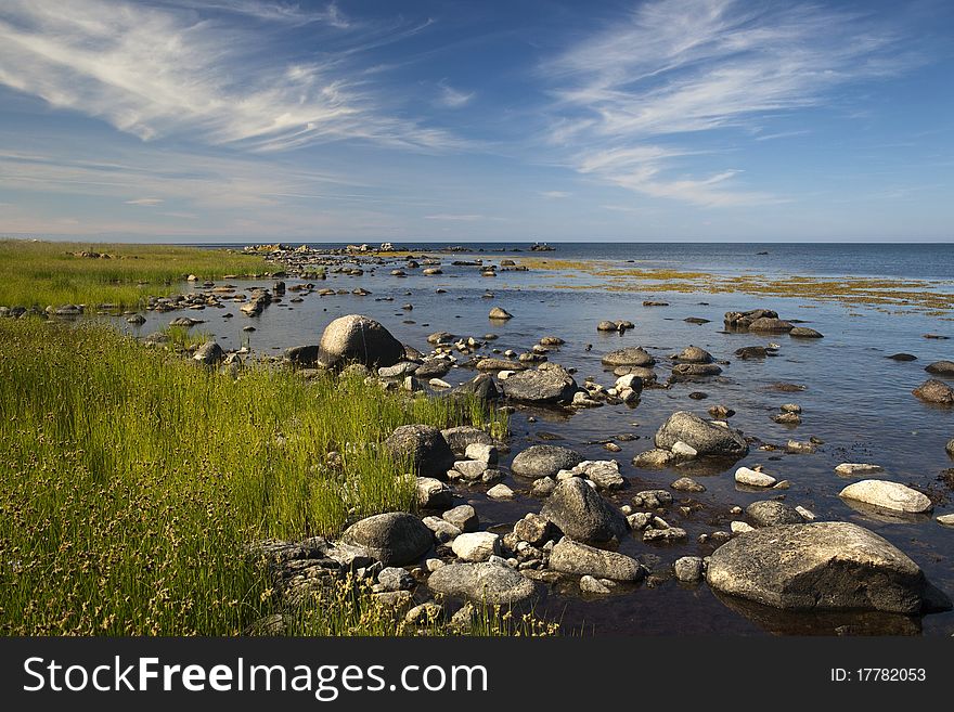 A stony shore at Ypnasted.between Svaneke and Gudhjem. Bornholm. Denmark. A stony shore at Ypnasted.between Svaneke and Gudhjem. Bornholm. Denmark.